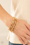 Metro Materials-Gold Stretch Bracelet-Paparazzi Accessories.